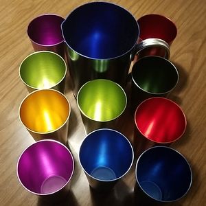 Metal pitcher and metal cups.